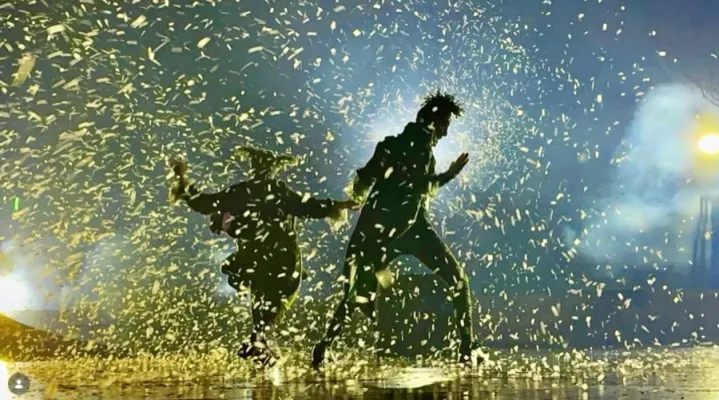Dancers in falling confetti